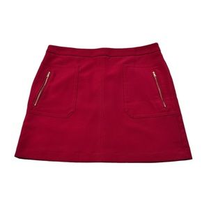 Loft red mini skirt with zipper pockets and rear zipper entry  Size 14